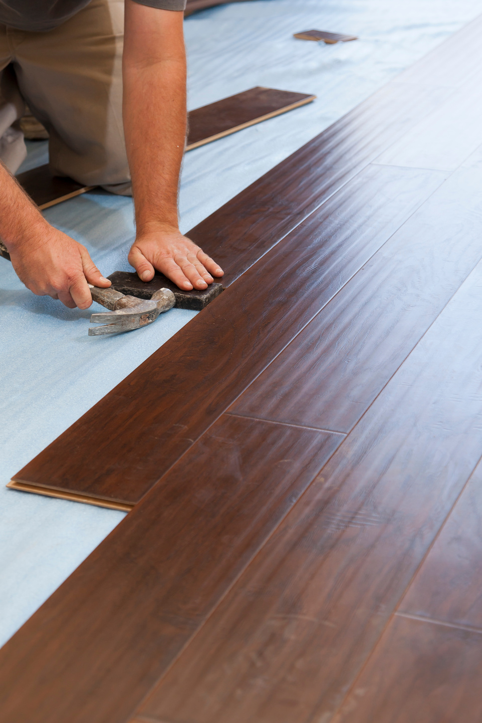 Man Installing Laminate Flooring